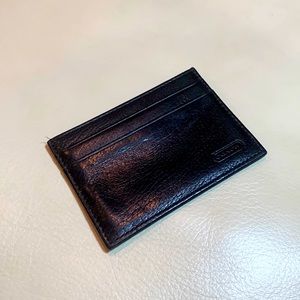 Coach black leather slim card holder wallet.